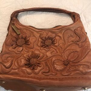 Leather appliqué statement bag